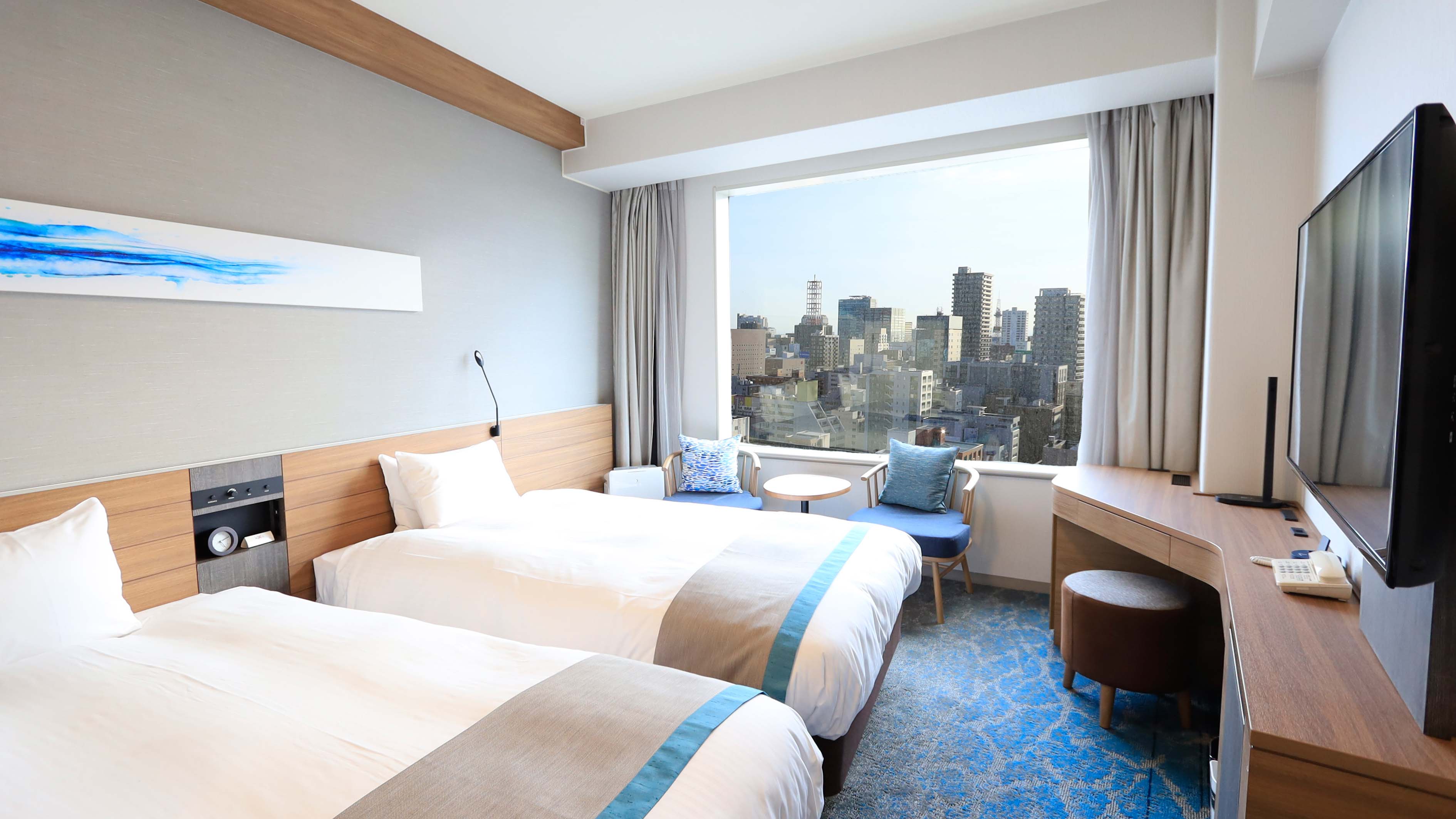 ＜14～21階＞スーペリアフロアは、札幌の豊平川をイメージしたブルーを基調に、スタイリッシュな空間。